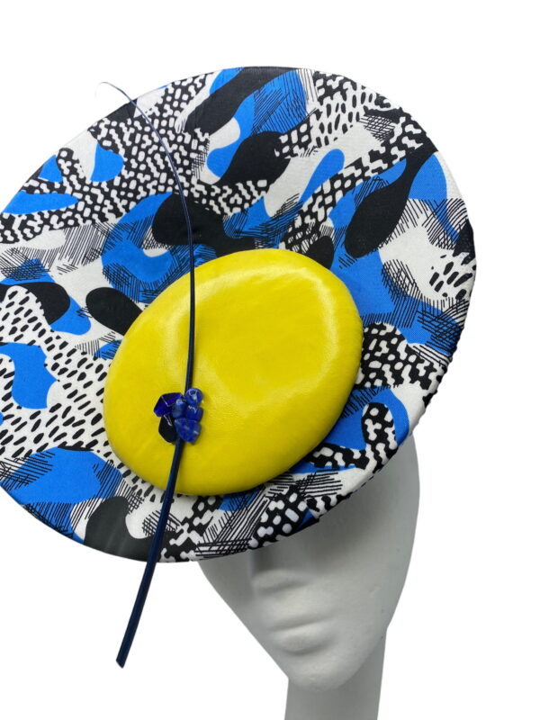 Blue percher headpiece with yellow leather inlay detail with blue and black pattern detail.